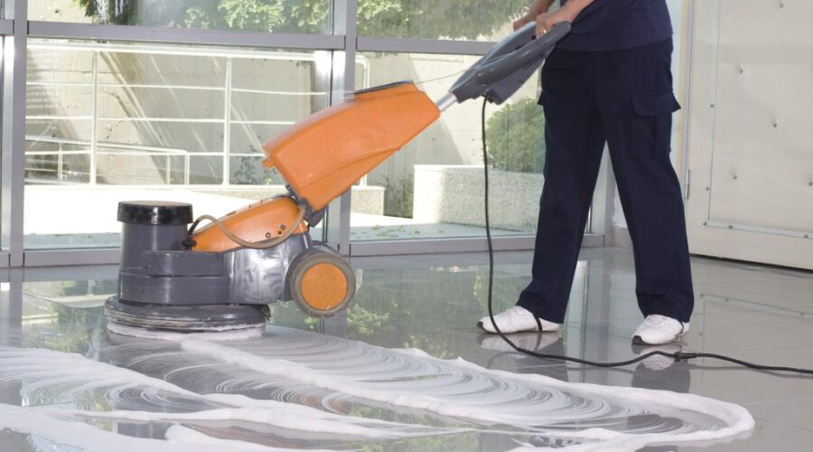 Cleaning the floor with machine